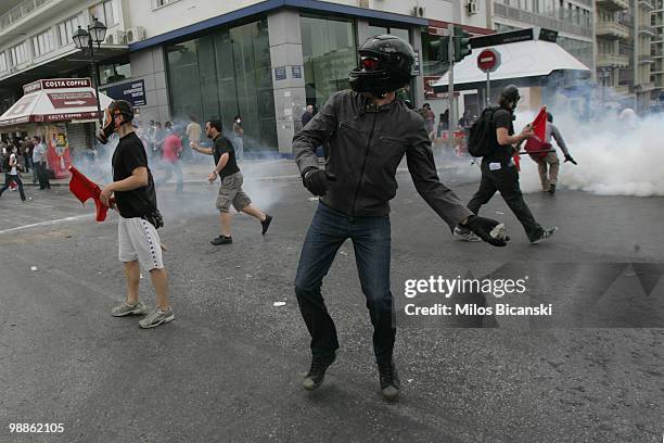 Protesters clash with Greek riot police outside parliament on May 5, 2010 in Athens, Greece. Three people have died after protesters set fire to the...