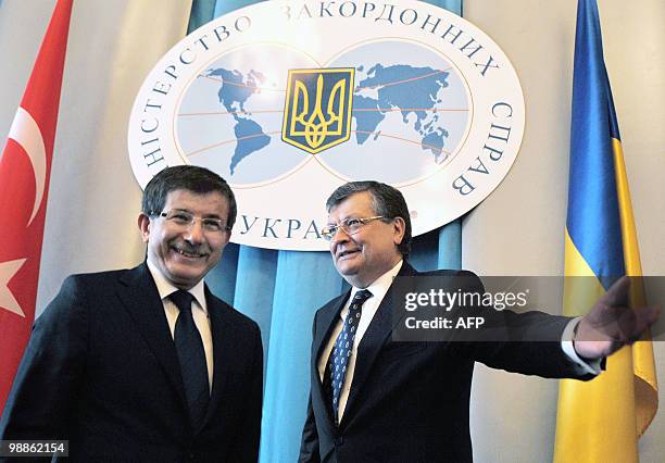 Ukraine's Foreign Minister Kostyantyn Gryshchenko welcomes his Turkish counterpart Ahmet Davutoglu during their meeting in Kiev on May 5, 2010....