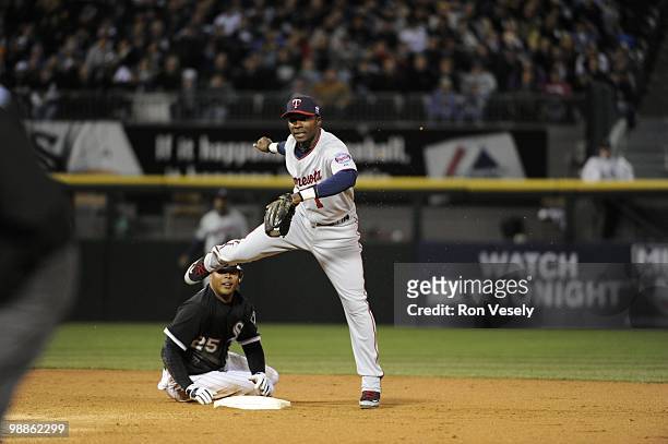 Orlando Hudson of the Minnesota Twins turns a double play against the Chicago White Sox on April 9, 2010 at U.S. Cellular Field in Chicago, Illinois....