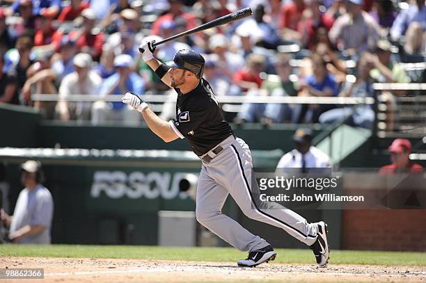 Mark Kotsay of the Chicago White Sox bats and runs to first base after hitting the ball during the game against the Texas Rangers at Rangers Ballpark...