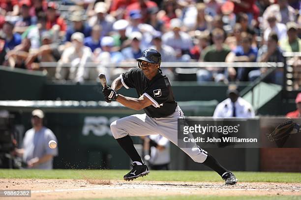 Juan Pierre of the Chicago White Sox bats and attempts to bunt for a base hit during the game against the Texas Rangers at Rangers Ballpark in...