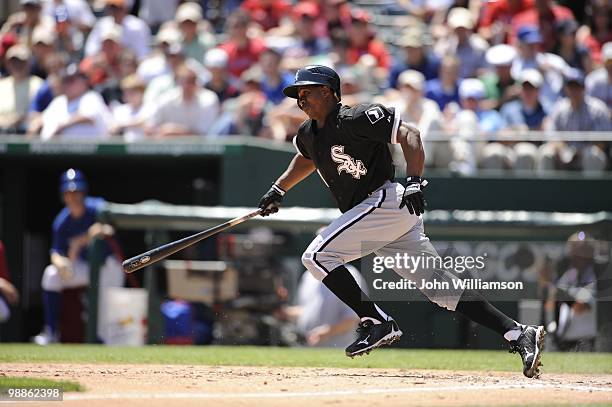 Juan Pierre of the Chicago White Sox bats and runs to first base as he attempts a bunt during the game against the Texas Rangers at Rangers Ballpark...