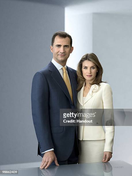In this handout photo from the Spanish Royal Household, Prince Felipe and Princess Letizia of Spain pose for an official portrait session at Zarzuela...
