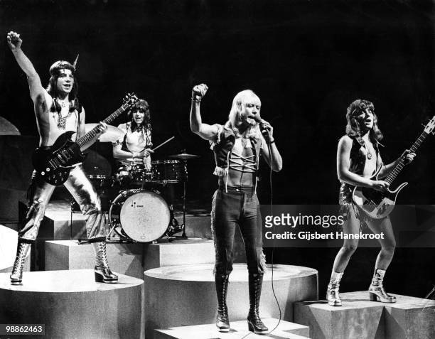 The Sweet perform live on stage at Hilversum, Netherlands circa 1974 L-R Andy Scott, Mick Tucker, Brian Connolly, Steve Priest
