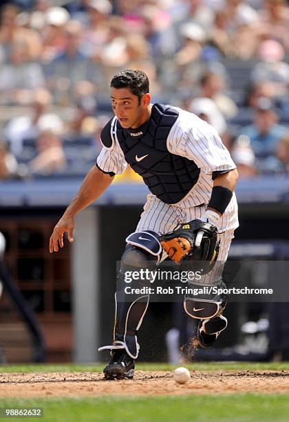 Jorge Posada of the New York Yankees defends his position against the Chicago White Sox at Yankee Stadium on May 01, 2010 in the Bronx borough of...