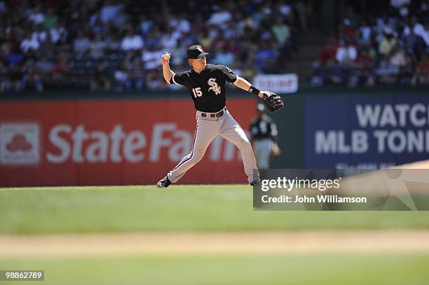 Second baseman Gordon Beckham of the Chicago White Sox fields his position as he throws to first base after catching a ground ball during the game...