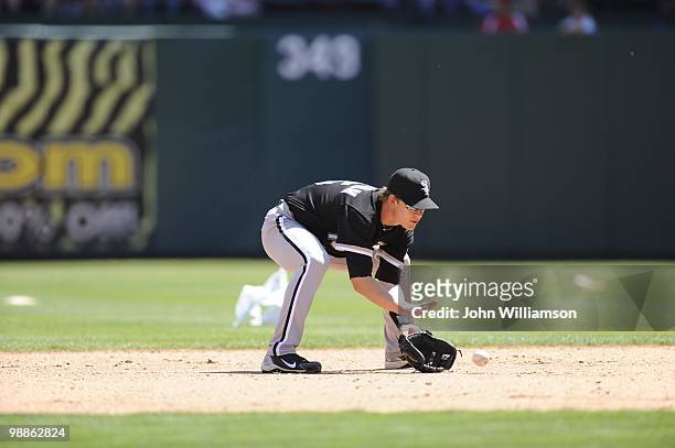Second baseman Gordon Beckham of the Chicago White Sox fields his position catches a ground ball during the game against the Texas Rangers at Rangers...