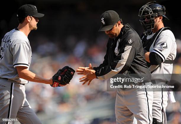 Ozzie Guillen manager of the Chicago White Sox makes a pitching change against the New York Yankees at Yankee Stadium on May 01, 2010 in the Bronx...