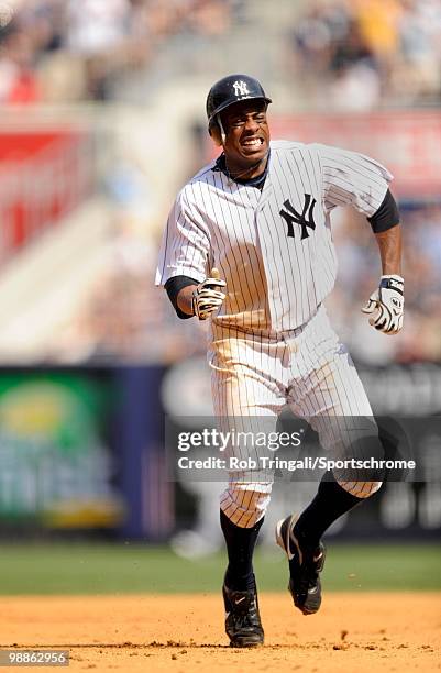 Curtis Granderson of the New York Yankees pulls up lame running the bases with an injury against the Chicago White Sox at Yankee Stadium on May 01,...