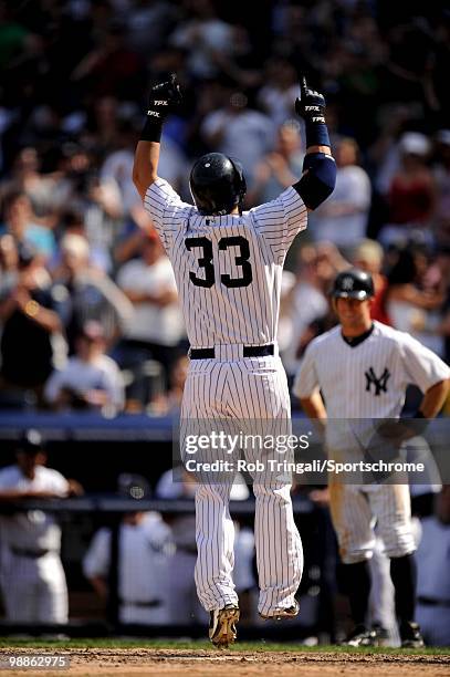 Nick Swisher of the New York Yankees gestures to the sky after hitting a home run against the Chicago White Sox at Yankee Stadium on May 01, 2010 in...