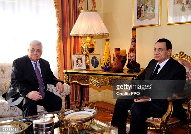 In this handout image supplied by the Palestinian Press Office , Palestinian President Mahmoud Abbas speaks with Egyptian President Hosni Mubarak...
