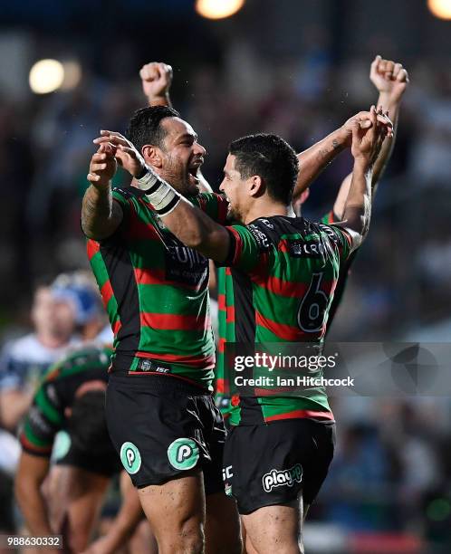 The Rabbitohs celebrate after winning the round 16 NRL match between the South Sydney Rabbitohs and the North Queensland Cowboys at Barlow Park on...