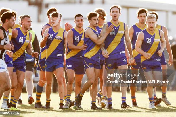 Williamstown players celebrate a goal during the round 13 VFL match between Williamstown and Collingwood at Williamstown Football Ground on July 1,...