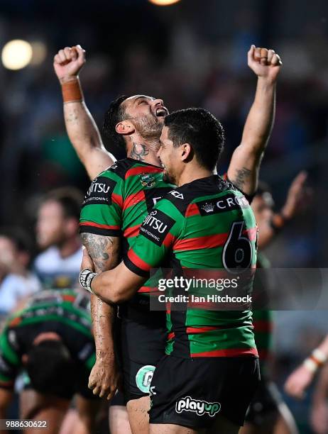 The Rabbitohs celebrate after winning the round 16 NRL match between the South Sydney Rabbitohs and the North Queensland Cowboys at Barlow Park on...