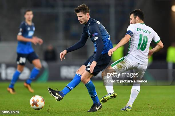 Hoffenheim's Havard Nordtveit and Razgrad's Svetoslav Dyakov in action during the Europa League group C soccer match between 1899 Hoffenheim and...