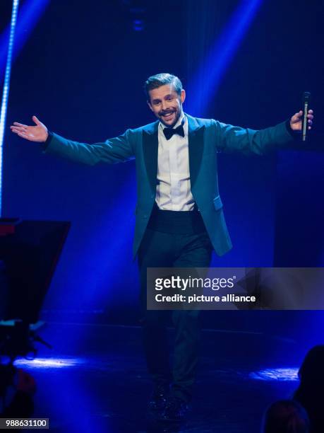 Klaas Heufer-Umlauf sings at the award ceremony of the '1Live Krone' award at the Jahrhunderthalle event hall in Bochum, Germany, 7 December 2017....