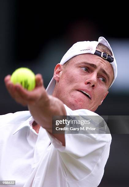 Lleyton Hewitt of Australia in action against Younes El Aynaoui of Morocco during the men's third round of The All England Lawn Tennis Championship...