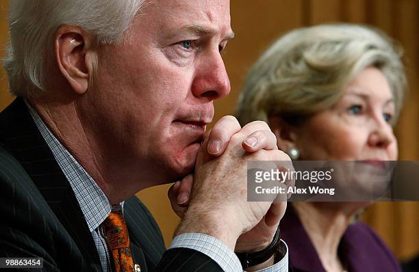 Sen. John Cornyn and Sen. Kay Bailey Hutchison listen during a hearing before the Senate Caucus on International Narcotics Control May 5, 2010 on...