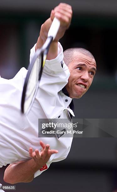 Younes El Aynaoui of Morocco in action against Lleyton Hewitt of Australia during the men's third round of The All England Lawn Tennis Championship...