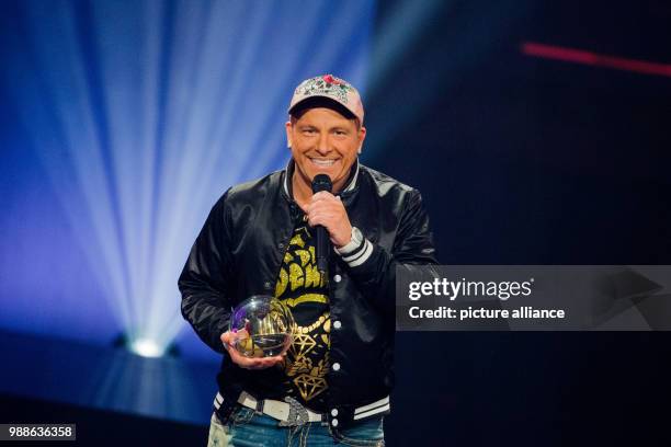 Comedian Dennis aus Huerth receives the award in the category 'Comedy' at the award ceremony of the '1Live Krone' award at the Jahrhunderthalle event...