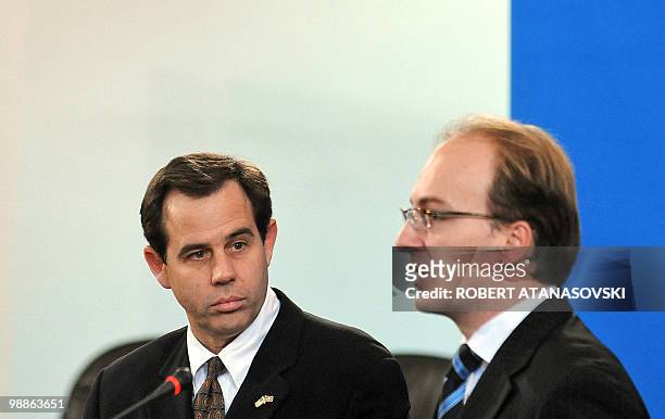 Deputy vice state secretary Stuart E. Jones listens to Macedonia's Foreign Minister Antonio Milososki during a press conference on October 28 in...