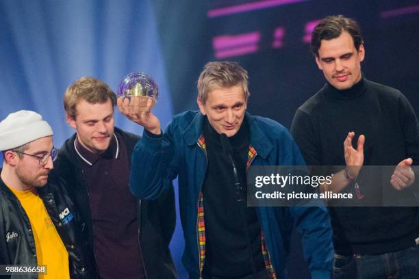 The band Kraftklub receives the awards as 'Best Live Act' at the award ceremony of the '1Live Krone' award at the Jahrhunderthalle event hall in...