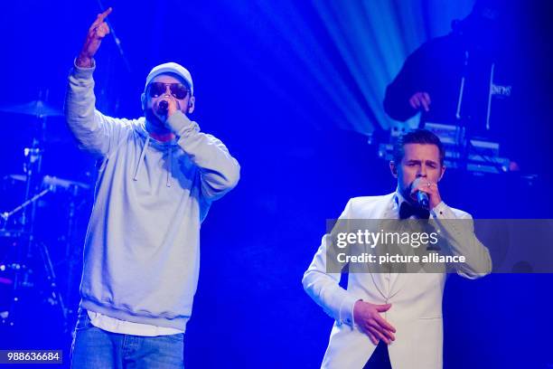 Host Klaas Heufer-Umlauf and rapper Sido perform at the award ceremony of the '1Live Krone' award at the Jahrhunderthalle event hall in Bochum,...