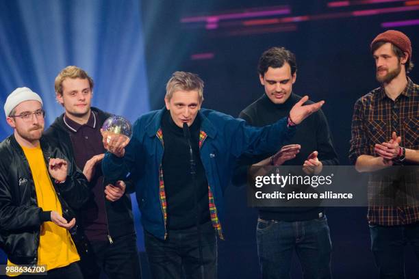 The band Kraftklub receives the awards as 'Best Live Act' at the award ceremony of the '1Live Krone' award at the Jahrhunderthalle event hall in...