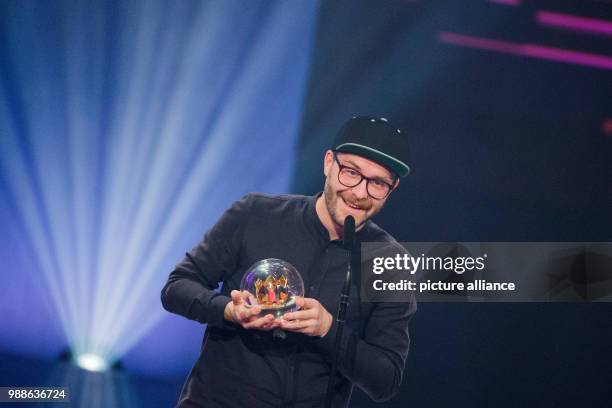 Signer Mark Forster receives the award for the 'Best single' at the award ceremony of the '1Live Krone' award at the Jahrhunderthalle event hall in...
