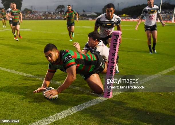 Robert Jennings of the Rabbitohs scores a try during the round 16 NRL match between the South Sydney Rabbitohs and the North Queensland Cowboys at...