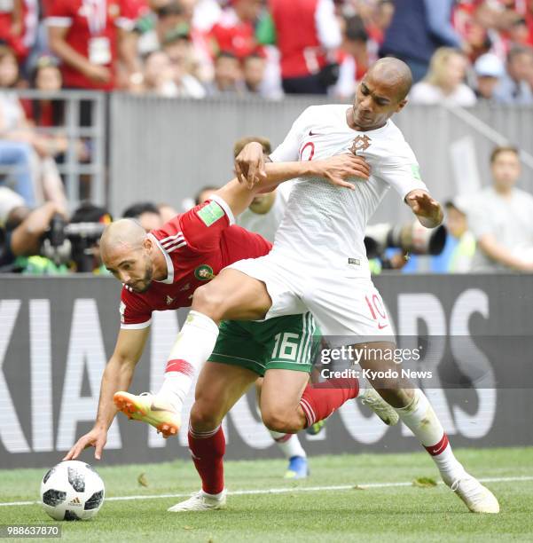 Morocco's Noureddine Amrabat and Portugal's Joao Mario fight for the ball during a World Cup Group B match at Luzhniki Stadium in Moscow on June 20,...