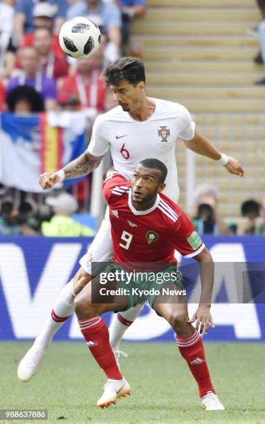 Portugal's Jose Fonte and Morocco's Ayoub El Kaabi compete for the ball during a World Cup Group B match at Luzhniki Stadium in Moscow on June 20,...