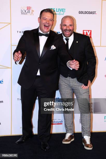 Gary Mehigan and George Calombaris arrive at the 60th Annual Logie Awards at The Star Gold Coast on July 1, 2018 in Gold Coast, Australia.