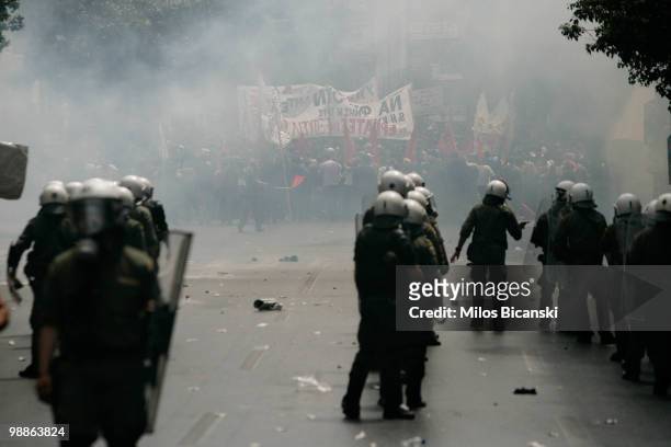 Greek riot police clash with protesters on May 5, 2010 in Athens, Greece. Three people have died after protesters set fire to the Marfin Egnatia Bank...