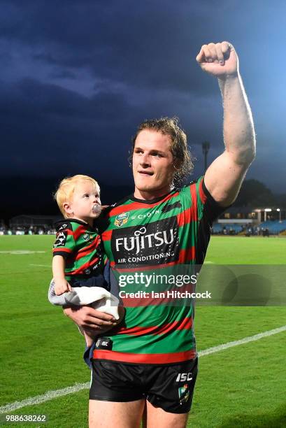 George Burgess of the Rabbitohs waves to the crowd with his son Boston at the end of the round 16 NRL match between the South Sydney Rabbitohs and...