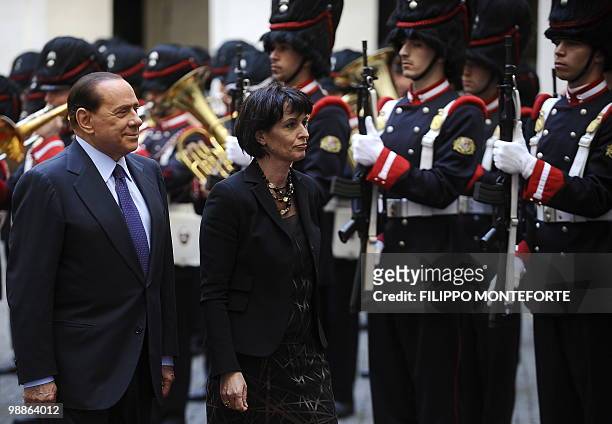 Italian Prime Minister Silvio Berlusconi and President of the Swiss Confederation Doris Leuthard review an honour guard prior their meeting on May 5,...