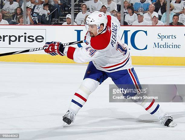 Tomas Plekanec of the Montreal Canadiens makes a pass against the Pittsburgh Penguins in Game Two of the Eastern Conference Semifinals during the...