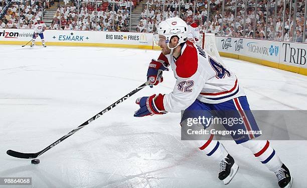 Dominic Moore of the Montreal Canadiens moves the puck up ice against the Pittsburgh Penguins in Game Two of the Eastern Conference Semifinals during...