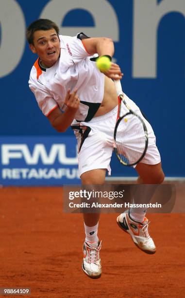 Andreas Beck of Germany serves the ball during his match against Mikhail Youzhny of Russia at day 4 of the BMW Open at the Iphitos tennis club on May...