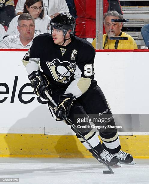 Sidney Crosby of the Pittsburgh Penguins moves the puck against the Montreal Canadiens in Game Two of the Eastern Conference Semifinals during the...