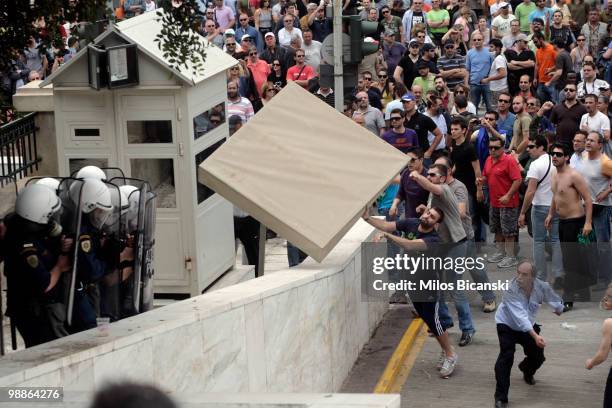 Greek riot police clash with protesters on May 5, 2010 in Athens, Greece. Three people have died after protesters set fire to the Marfin Egnatia Bank...