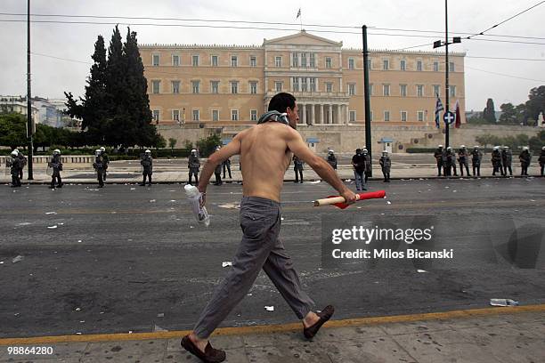 Greek riot police clash with protesters on May 5, 2010 in Athens, Greece. Three people have died after protesters set fire to the Marfin Egnatia Bank...