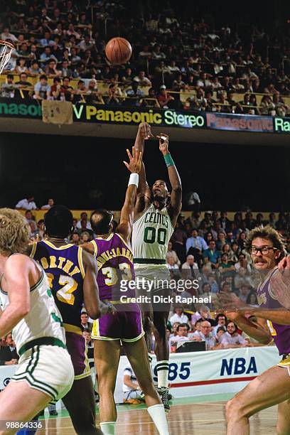 Robert Parish of the Boston Celtics shoots a jump shot against Kareem Abdul-Jabbar of the Los Angeles Lakers during the 1985 NBA Finals at the Boston...