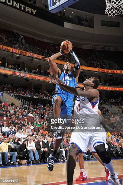 Dwight Howard of the Orlando Magic makes a jumpshot against Samuel Dalembert of the Philadelphia 76ers during the game on March 22, 2010 at the...