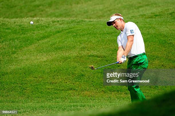 Luke Donald of England hits a shot during a practice round prior to the start of THE PLAYERS Championship held at THE PLAYERS Stadium course at TPC...
