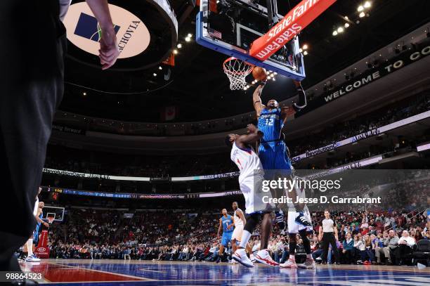 Dwight Howard of the Orlando Magic puts a shot up against Samuel Dalembert of the Philadelphia 76ers during the game on March 22, 2010 at the...