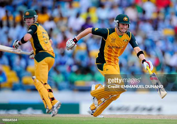 Australian captain Michael Clarke and batsman Brad Haddin score a run during The ICC World Twenty20 Group A match between Bangladesh and Australia at...