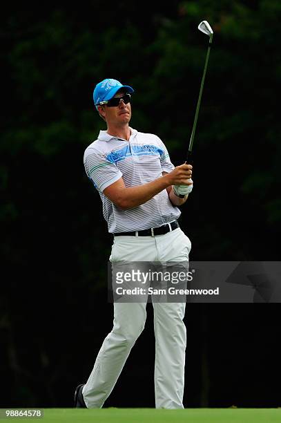 Henrik Stenson of Sweden watches a shot during a practice round prior to the start of THE PLAYERS Championship held at THE PLAYERS Stadium course at...