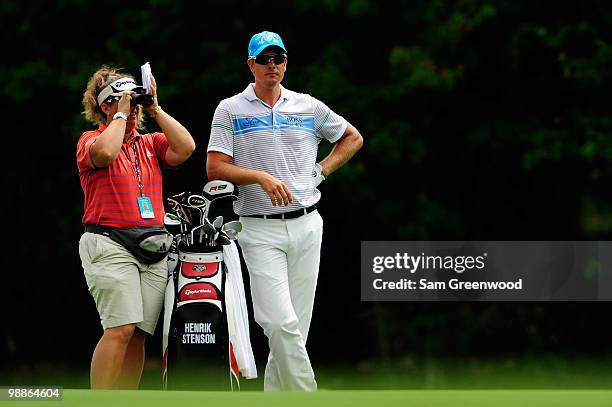 Henrik Stenson of Sweden stand with caddie Fanny Sunesson during a practice round prior to the start of THE PLAYERS Championship held at THE PLAYERS...