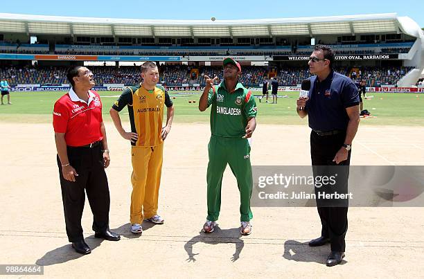 Michael Clarke of Australia looks on as Shakib Al Hasan tosses the coin before The ICC World Twenty20 Group A Match between Bangladesh and Australia...